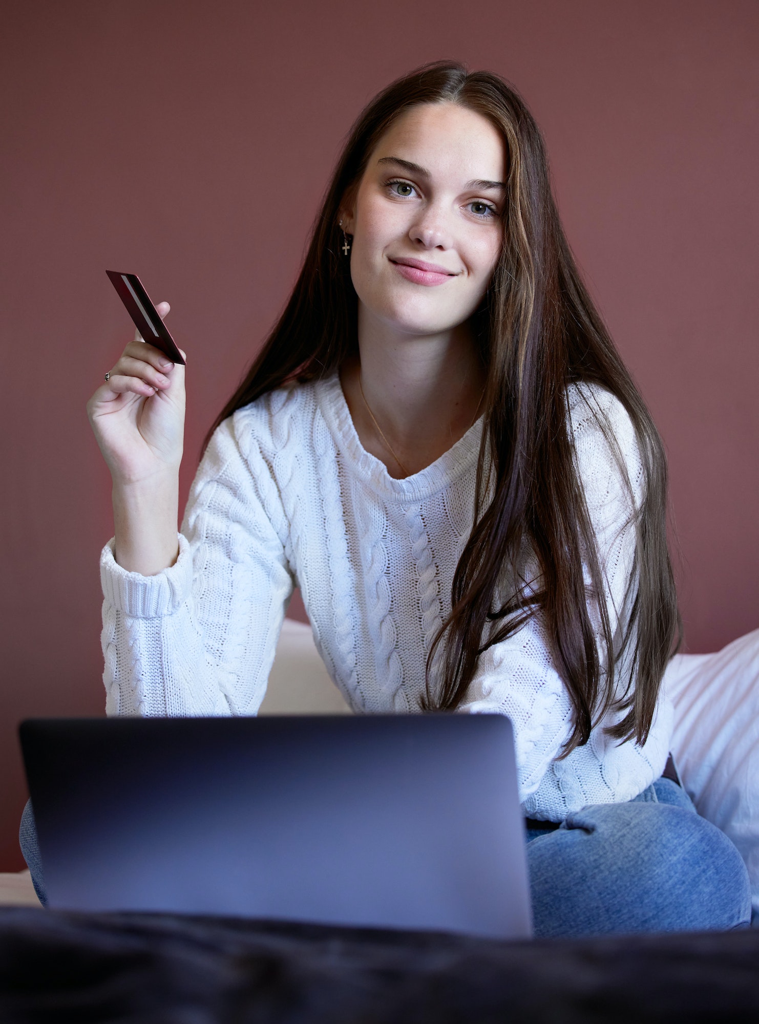 Debt free and happier than ever. Shot of a young woman shopping online using her laptop.